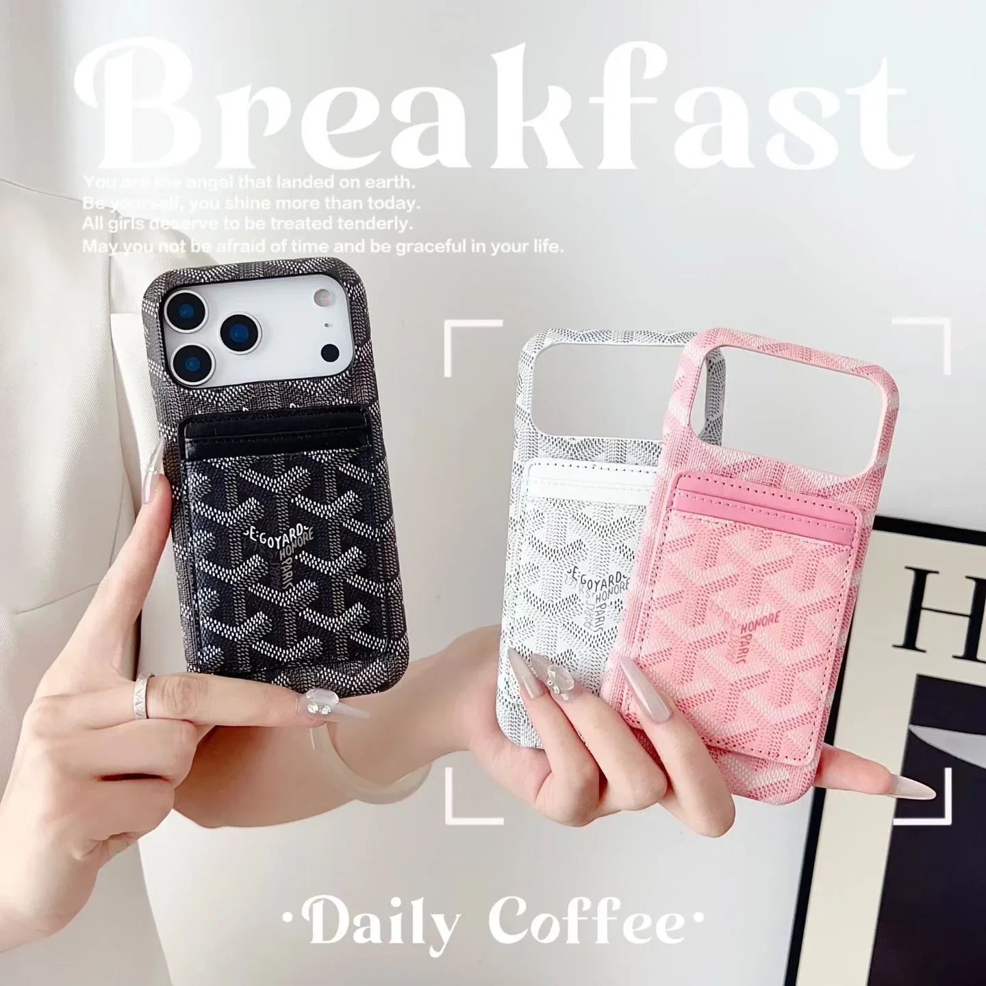 Three luxury Goyard-inspired iPhone 17 Pro Max cases with card holders in black, white, and pink.