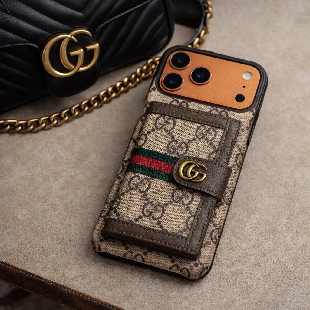 Designer iPhone 17 Pro Max case with card holder and gold logo on textured surface