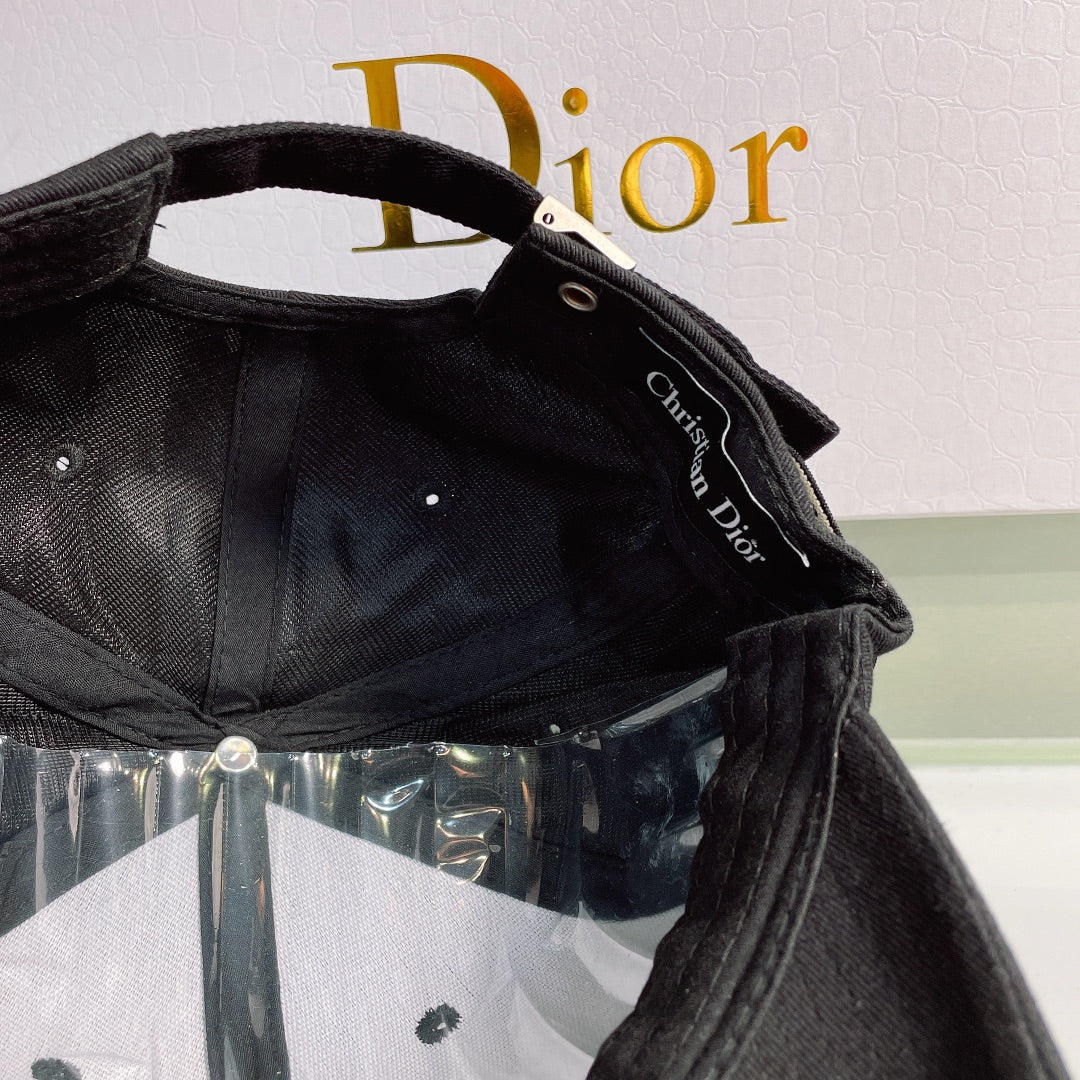 Black cap with Christian Dior logo on a white background