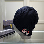 Designer cable knit winter hat