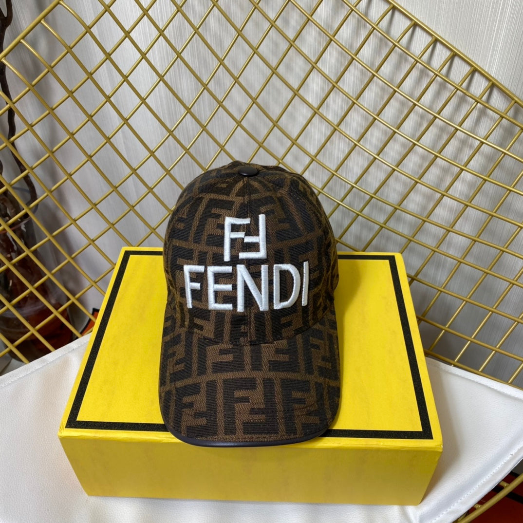 Fendi cap on a yellow box with a gold grid background