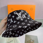 Louis Vuitton black monogram bucket hat with white LV pattern