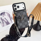 Louis Vuitton phone case with checkered pattern and strap held by a hand.