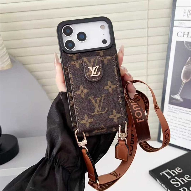 Louis Vuitton phone case with strap held by a hand