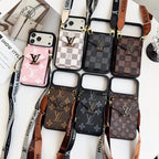 Collection of Louis Vuitton phone cases with lanyards on a white background