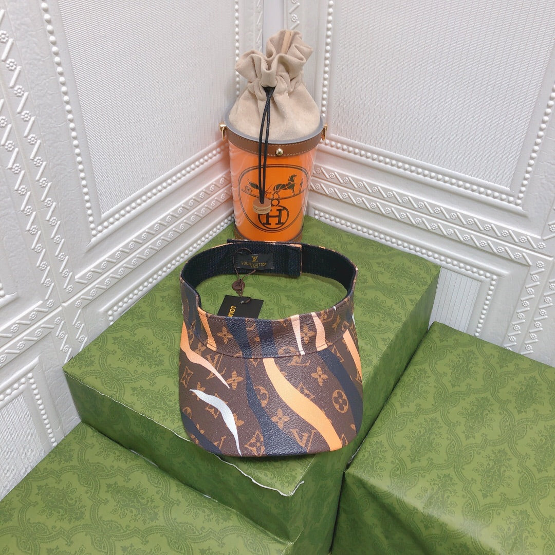 Louis Vuitton leather top hat orange ivory front view