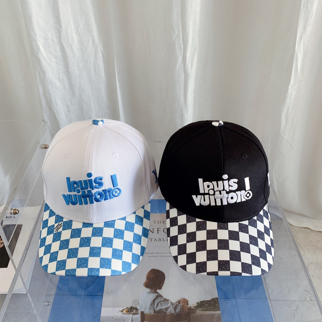 Two Louis Vuitton caps with checkered brims on a white background