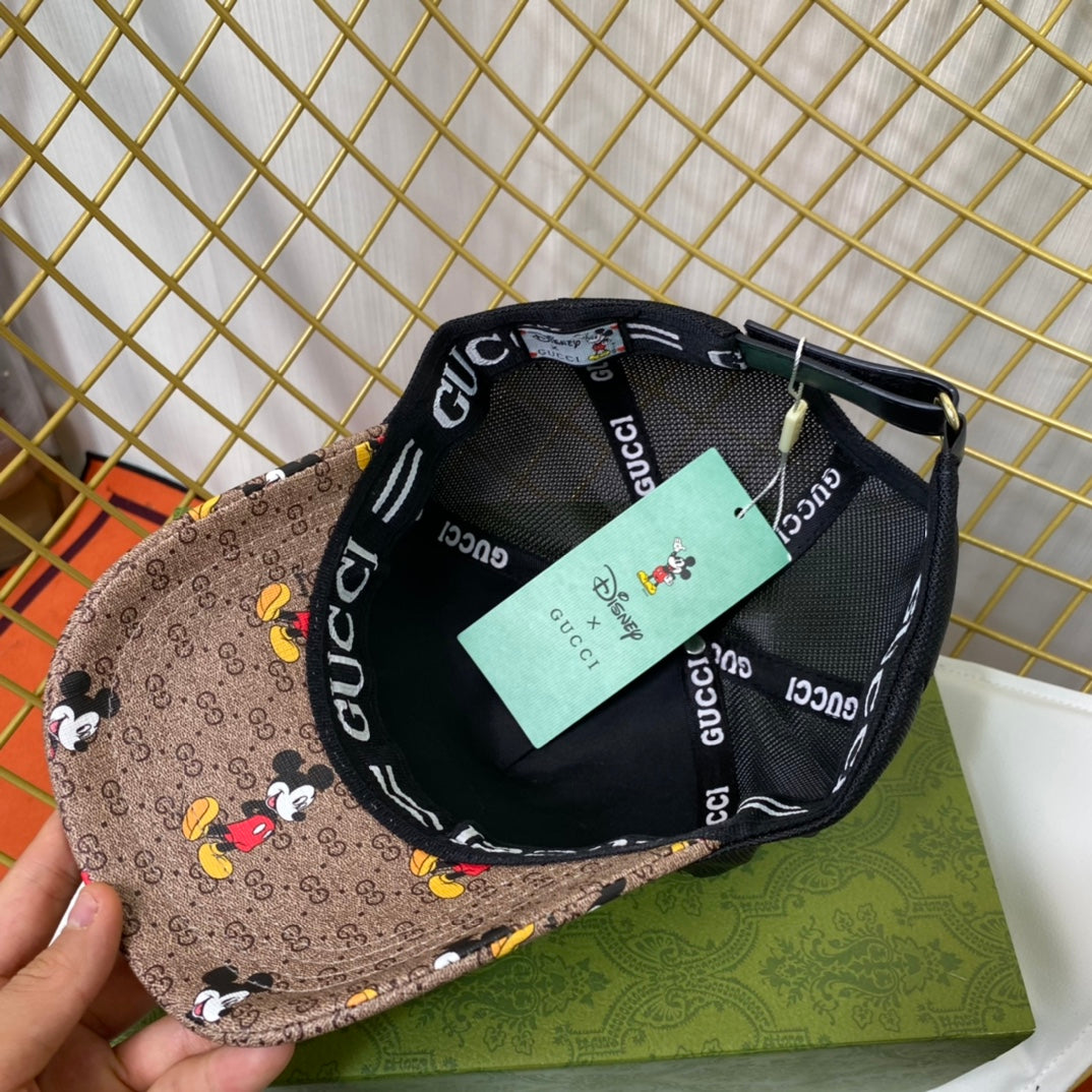 Two caps, one with Gucci logo and another with Disney design, on a grid background.