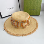 Luxury Gucci woven raffia beach hat side profile