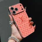Orange Louis Vuitton shiny phone cover close-up