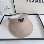 Beige visor with Prada logo on a Chanel branded box
