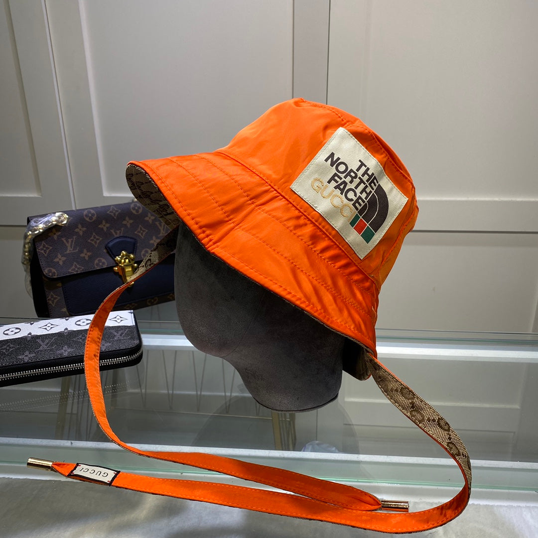The North Face reversible bucket hat orange khaki front view