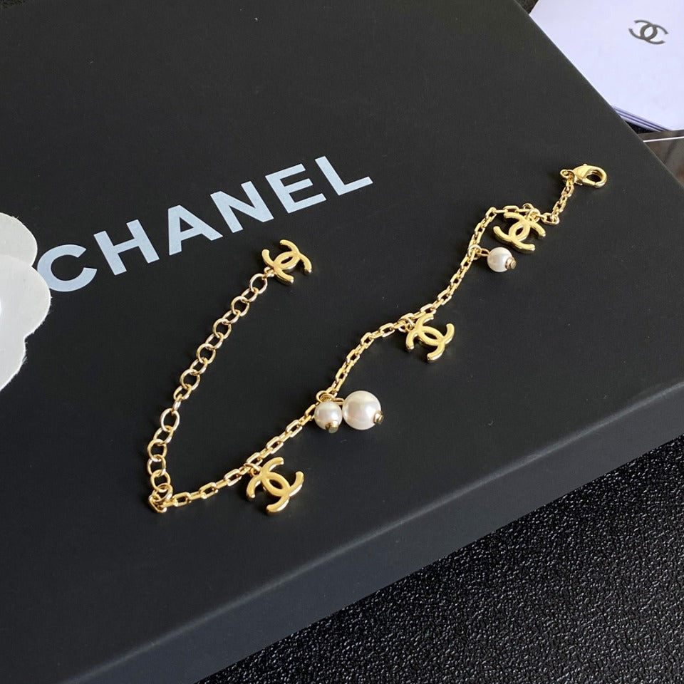 Chanel Gold Logo Pearl Charm Bracelet – Luxury Jewelry – product image 1