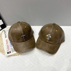 Brown leather cross emblem baseball caps pair