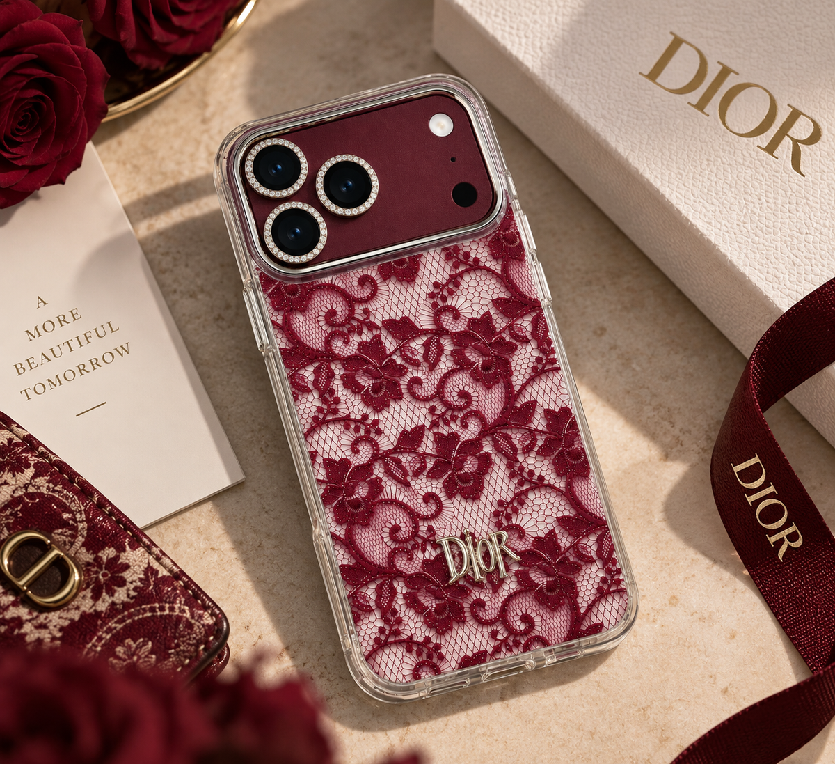 Luxury burgundy floral lace iPhone 18 Pro Max case displayed beside Dior-inspired packaging