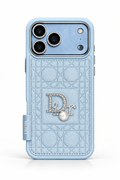 Glacier blue Dior-style quilted case for iPhone 18 Pro Max with crystal emblem and pearl detail