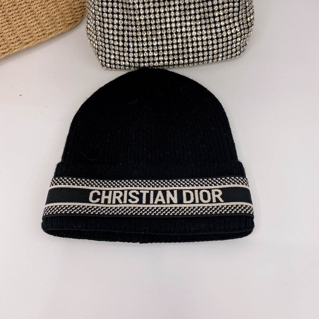 Black beanie with 'Christian Dior' logo on a white background