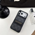 Gucci phone case on a white surface with a black background