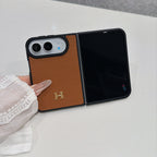 Brown pebbled leather-style iPhone Duo case with gold H logo