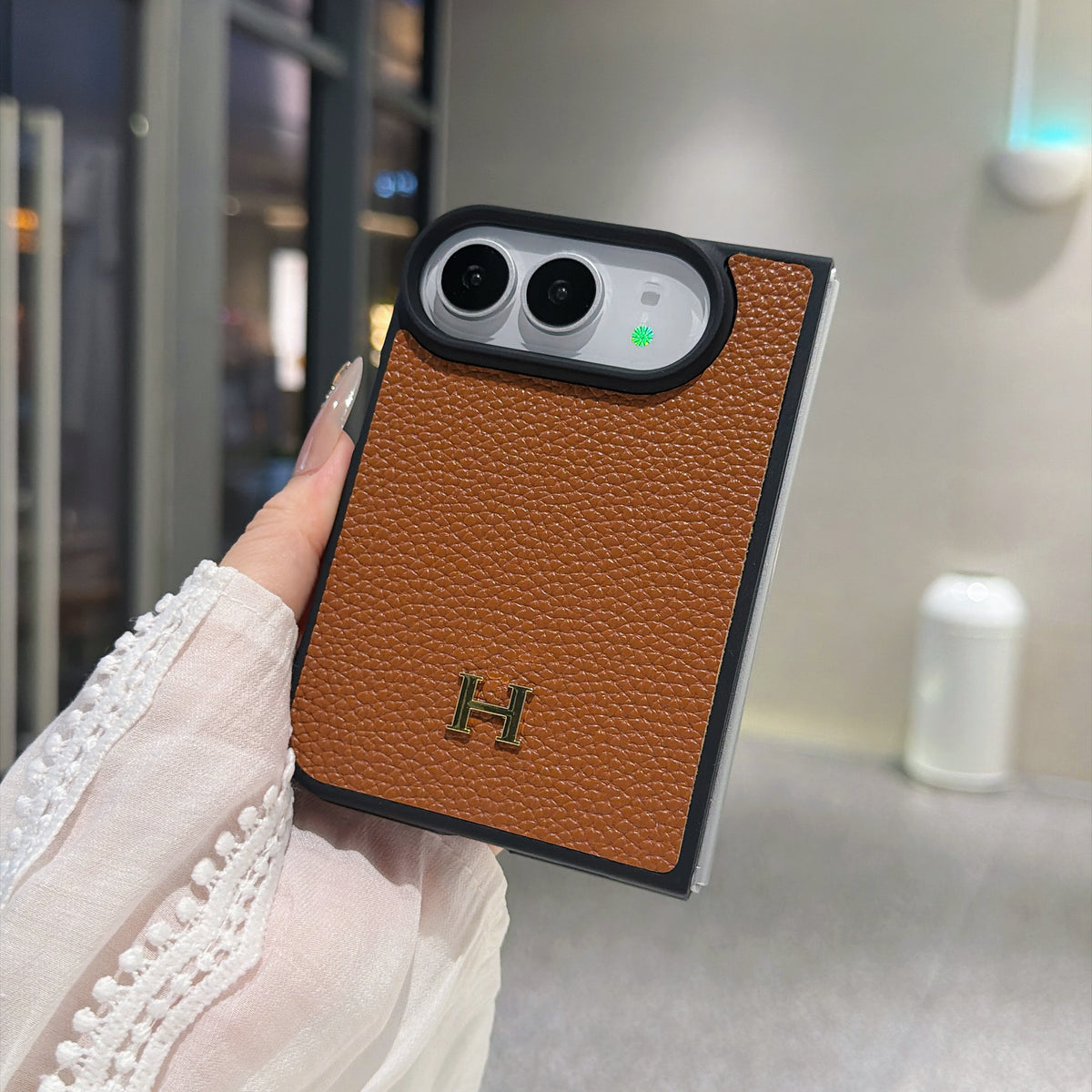 Brown luxury iPhone Duo case with gold H logo