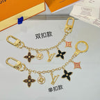 Louis Vuitton flower charm keychain displayed with luxury packaging
