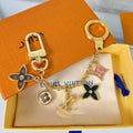 Louis Vuitton flower charm keychain with gold-tone hardware and colourful enamel pendants