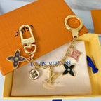 Louis Vuitton flower charm keychain with gold-tone hardware and colourful enamel pendants