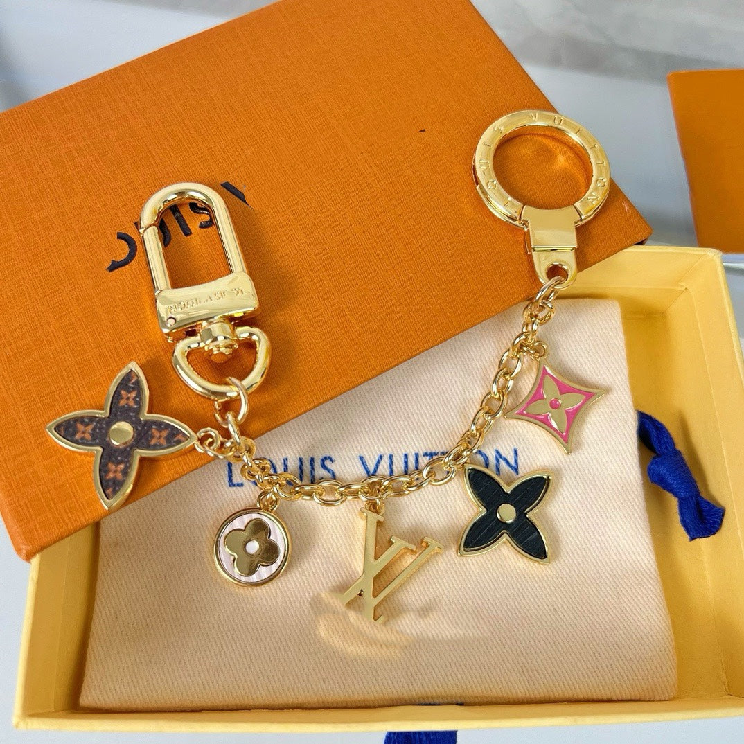 Louis Vuitton flower charm keychain with gold-tone hardware and colourful enamel pendants