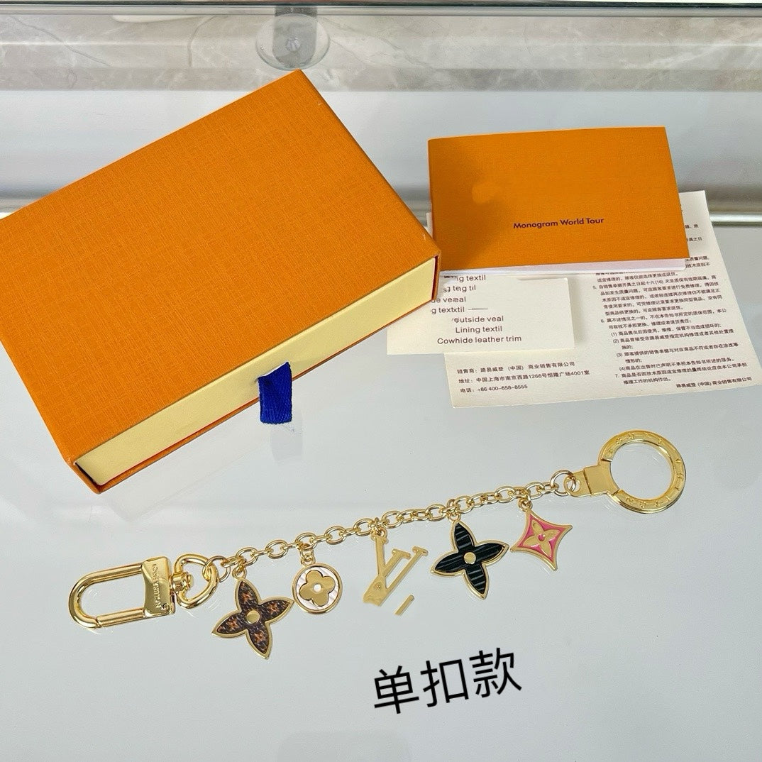 Louis Vuitton flower charm keychain close-up showing signature-inspired details