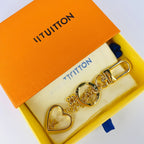 Louis Vuitton heart love charm keychain displayed in orange box