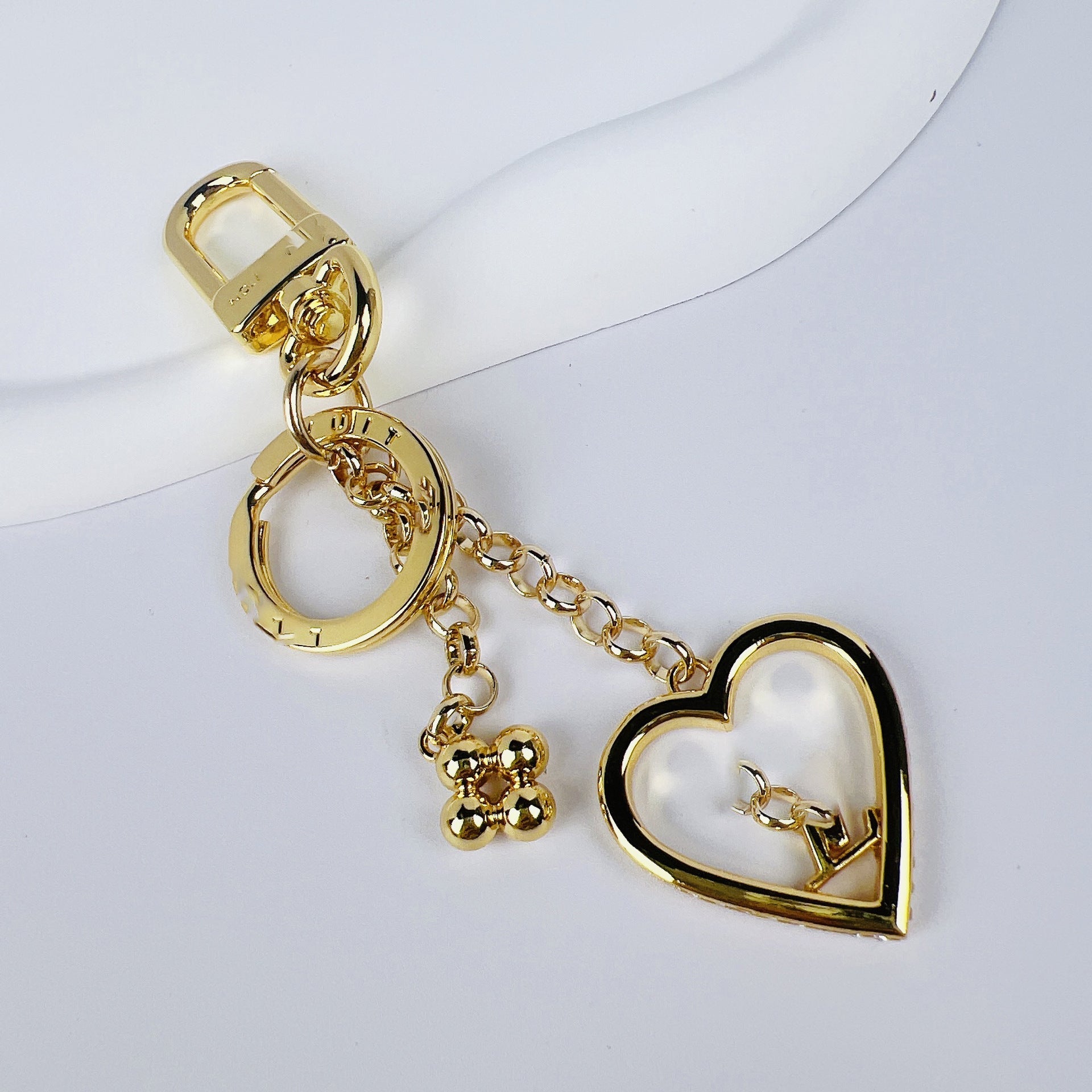 Louis Vuitton heart love charm keychain with gold-tone hardware
