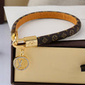 Louis Vuitton Logo Pendant Monogram Leather Bracelet – Luxury Jewelry – product image 1