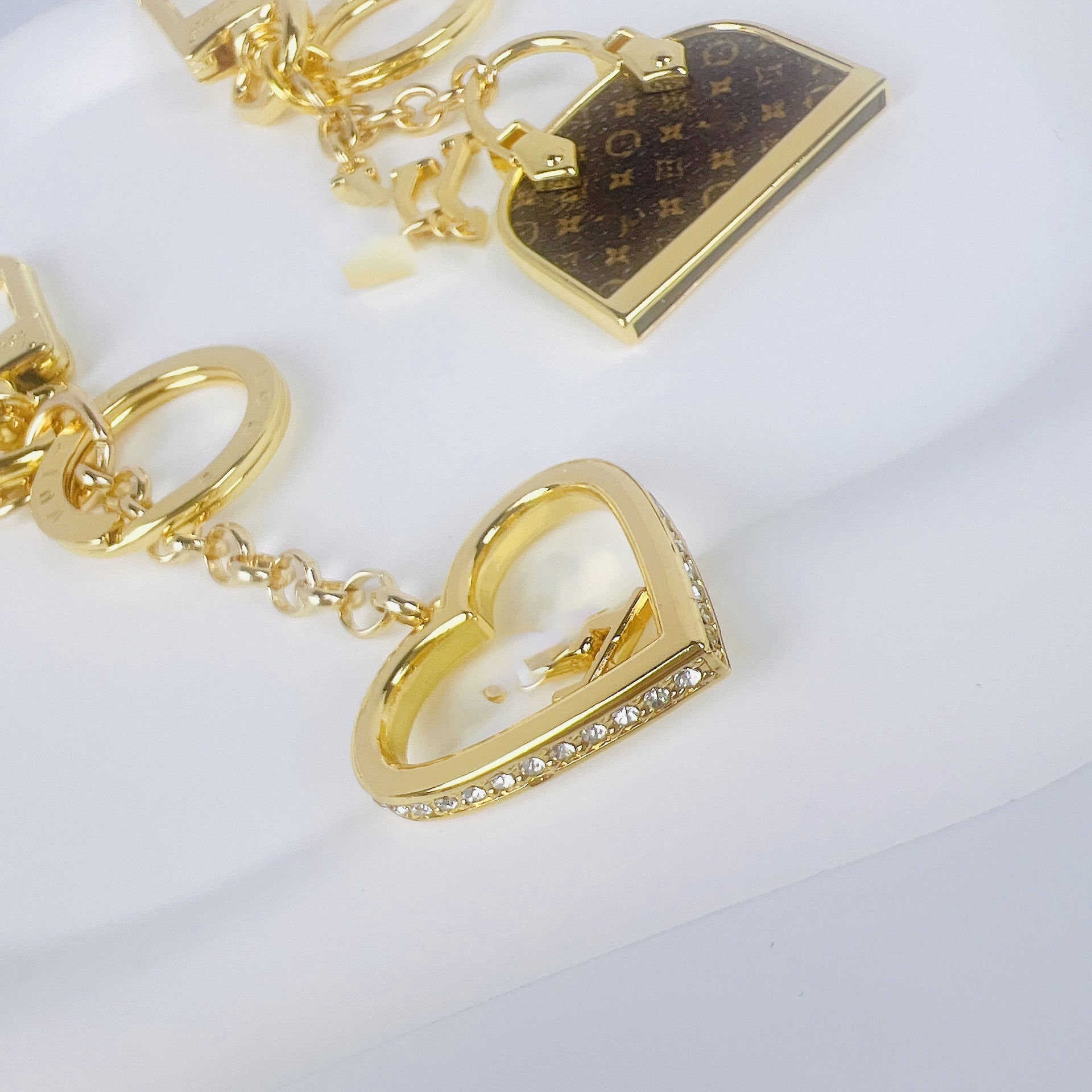 Louis Vuitton mini bag and heart love charm keychain options