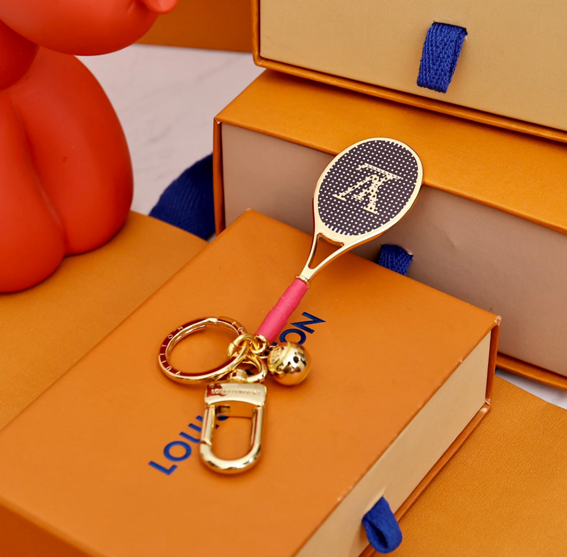 louis-vuitton-tennis-racket-keychain-gold