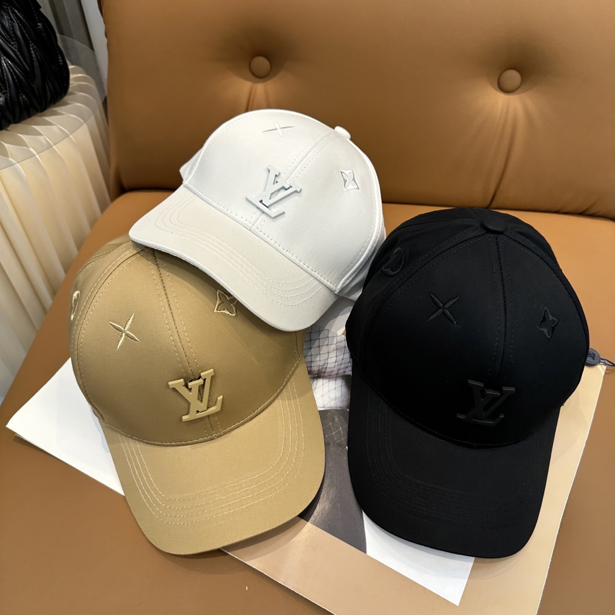 Louis Vuitton tonal LV caps in white beige and black