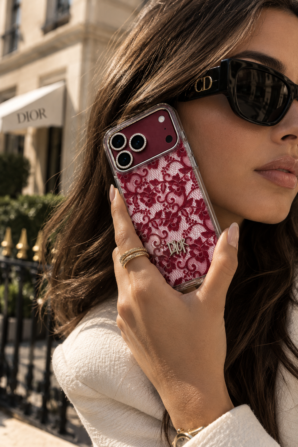 Burgundy Dior-style lace case for iPhone 18 Pro Max with clear frame and gold emblem