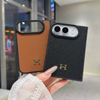 Black luxury iPhone Duo case with gold-tone H emblem