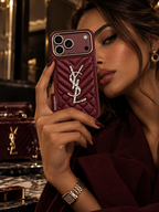 Burgundy YSL luxury case for iPhone 18 Pro – lifestyle view