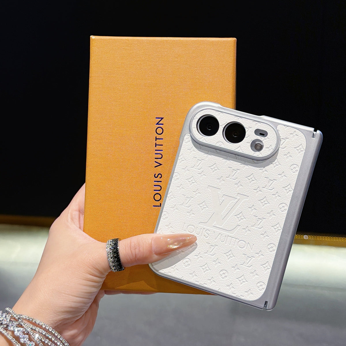 Louis Vuitton Embossed Monogram iPhone Duo Case in gallery detail