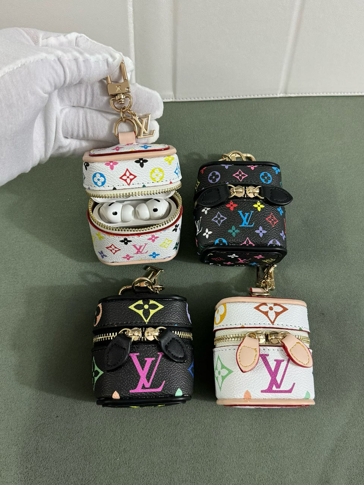 Louis Vuitton Multicolor Monogram Zip Earbud Pouch in pattern and finish overview